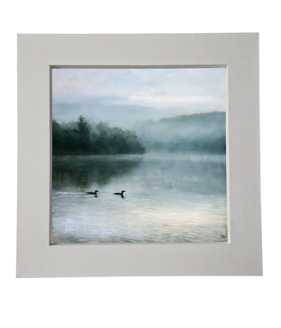 Two common loons swimming quietly across a glassy, calm lake in rustic tones — product view 6