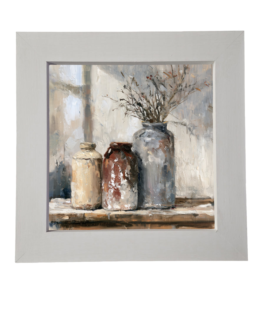 Rustic still life of ceramic crocks and wildflowers on a wooden table in neutral tones