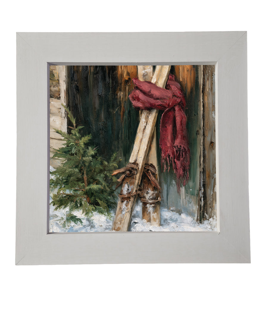 vintage wooden skis with a red scarf beside an evergreen tree in a snowy rustic winter scene