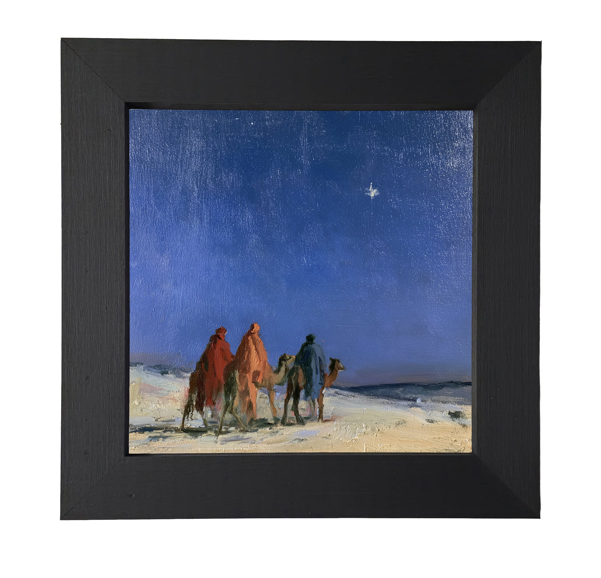 Three Wise Men traveling together across a quiet landscape in a rustic nativity scene, framed in black, white, and gold.
